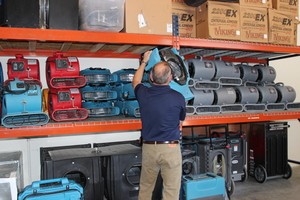 Mold Damage Restoration Technician Prepping Air Movers